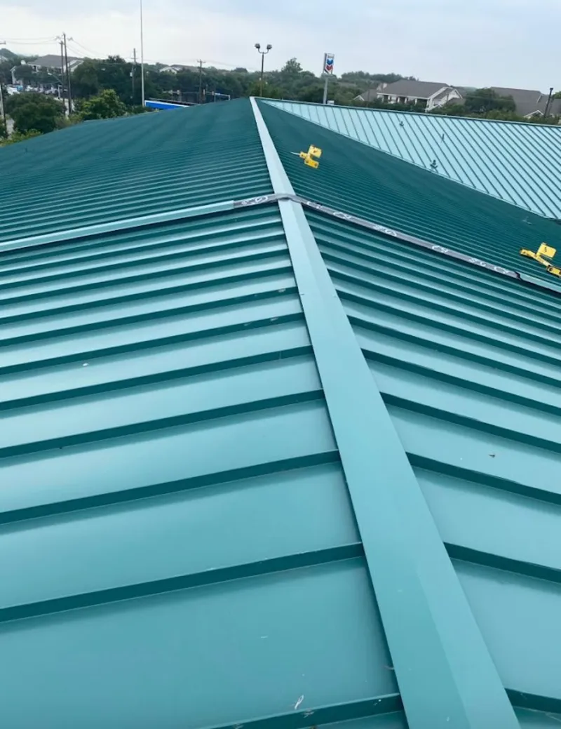 Green commercial metal roof ridge and valley for Metal Roof Repair in Litchfield Beach