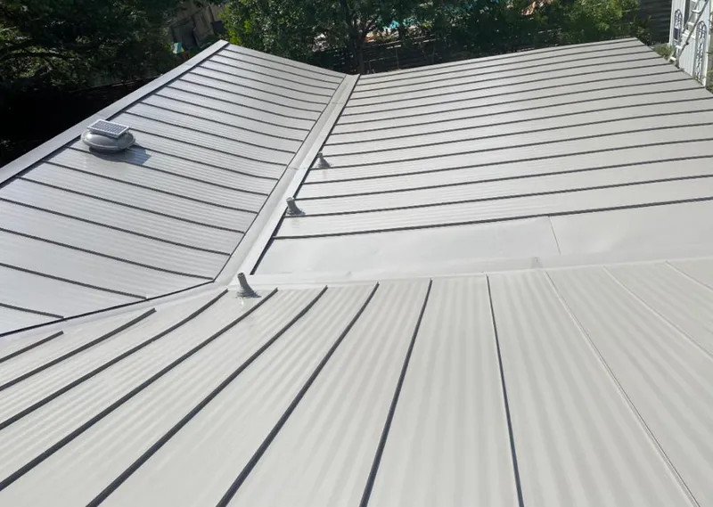 Solar attic fan installed on a metal roof for Roof Ventilation in Litchfield Beach